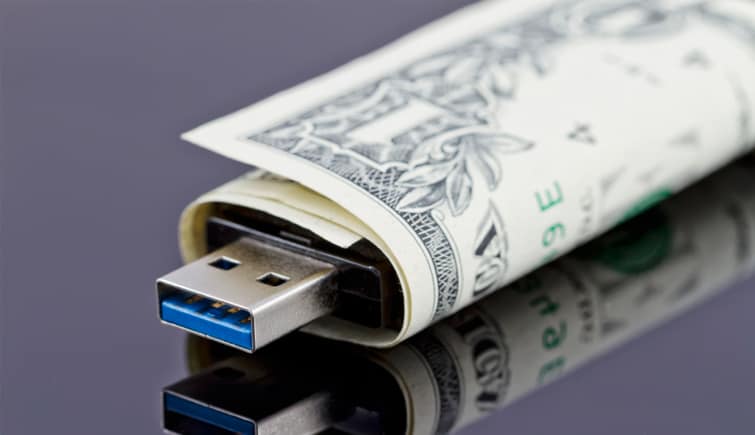 A usb drive wrapped in a dollar bill