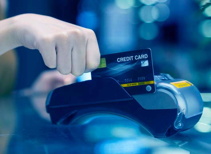 A person swipes their card through